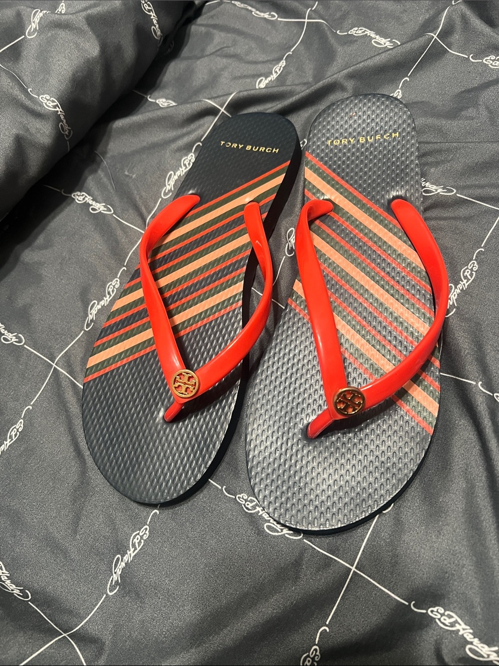 Tory Burch Black Flip Flops with Red Straps and Stripe Detail